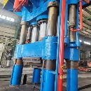 新定1600吨锻造油压机加15吨360度旋转操作机，